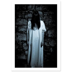 mysterious female figure in a white dress