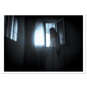 A solitary figure in a flowing white dress stands among overgrown ruins