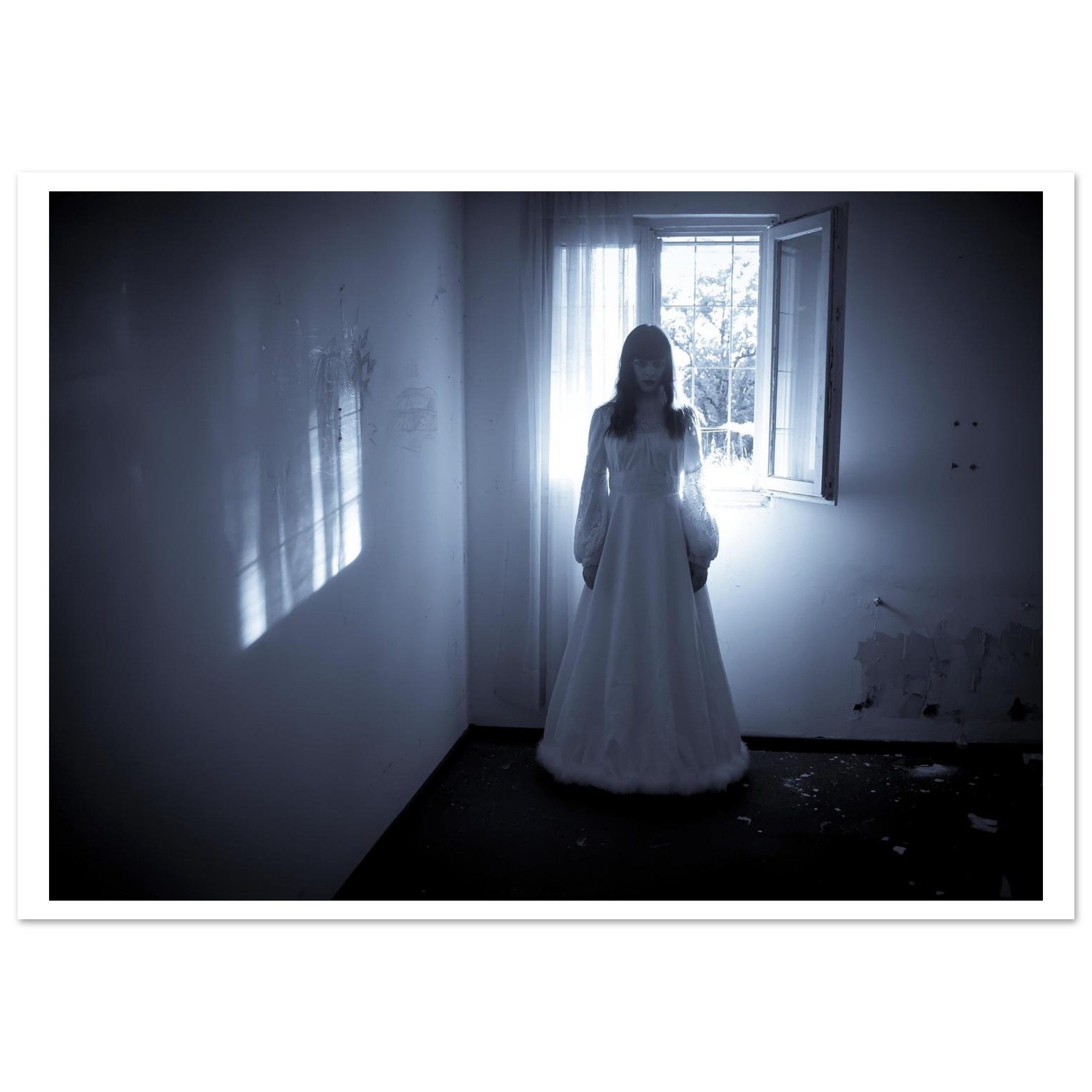 a solitary female figure sits in shadow